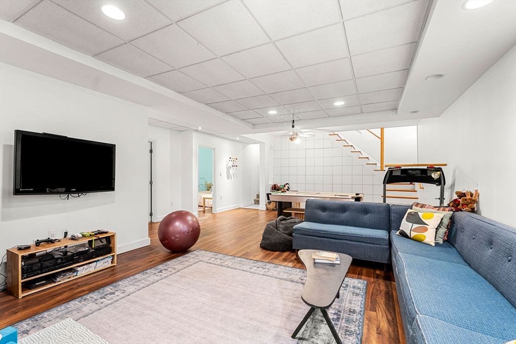 58 Leicester Road Marblehead, MA 01945 - Photo 34 of 42 a living room with furniture and a flat screen tv