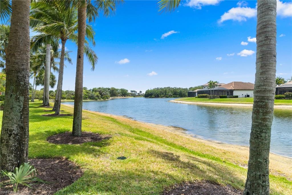 6414 Legacy Circle, Unit 903 Naples, FL 34113 - Photo 37 of 50 a view of a lake with a big yard
