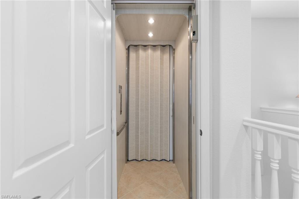 6414 Legacy Circle, Unit 903 Naples, FL 34113 - Photo 9 of 50 a view of a hallway with entryway