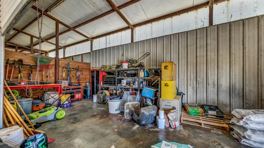 1003 Lamkin Road Mineral Wells, TX 76067 - Photo 39 of 40 Garage featuring a workshop area and metal wall