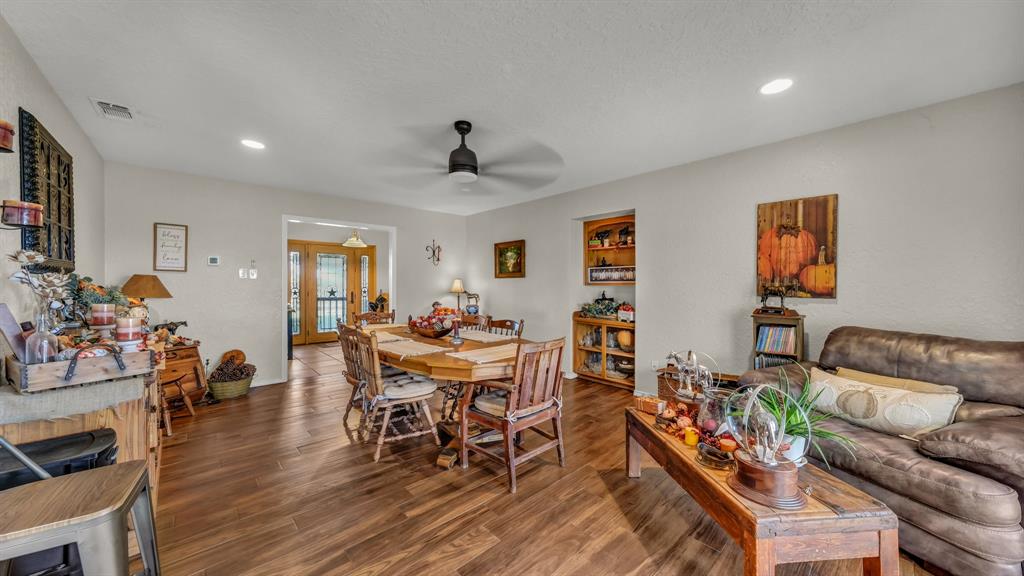 1003 Lamkin Road Mineral Wells, TX 76067 - Photo 4 of 40 Dining room with recessed lighting, wood finished floors, ceiling fan, and french doors