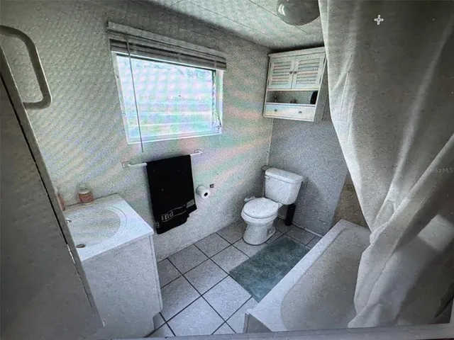 a view of backyard with cabin