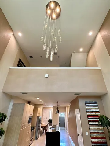 a view of swimming pool with chairs and fire pit