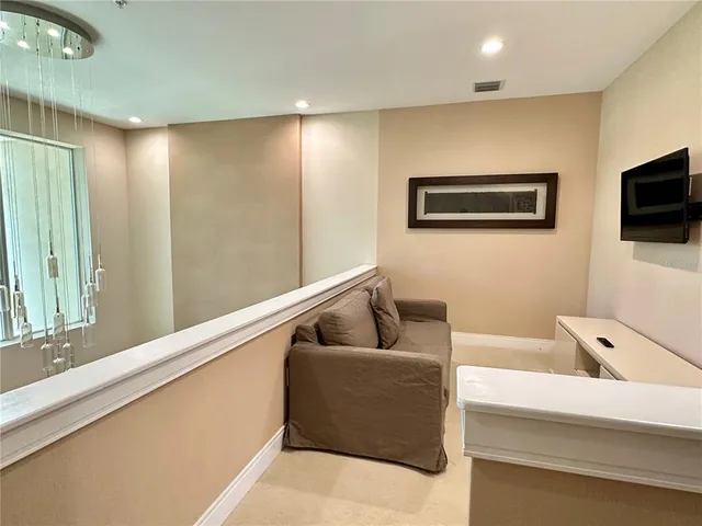 a spacious bedroom with a bed and a couch