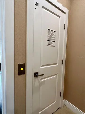 a bedroom with a bed and a mirror