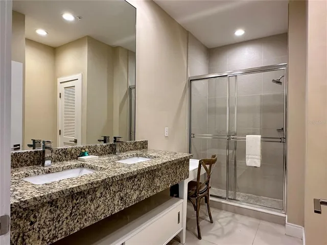 a bathroom with a shower and a bath tub
