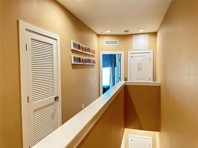 a view of a hallway with seating area