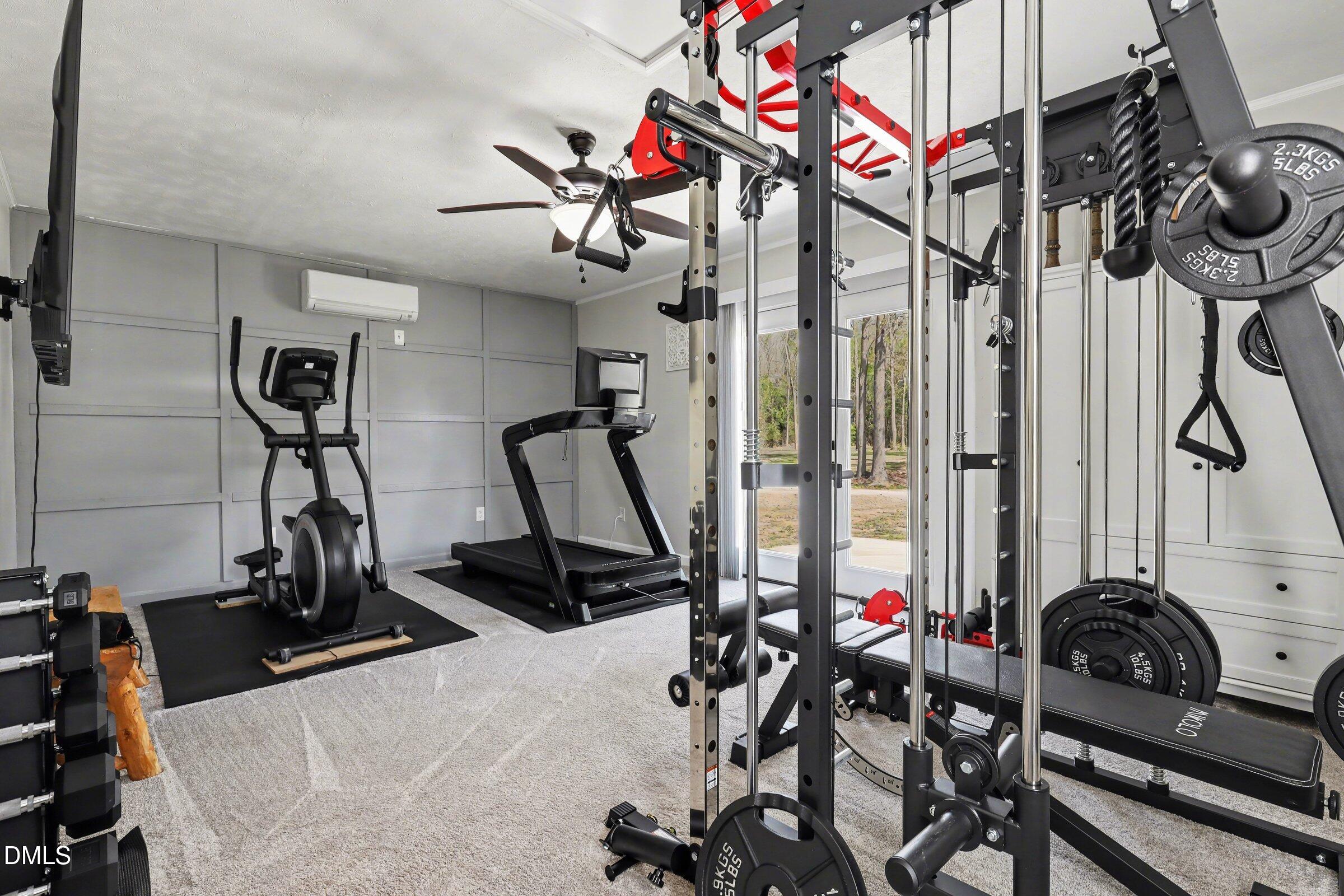 430 Fred Hall Road Stedman, NC 28391 - Photo 57 of 63 a view of a room with gym equipment