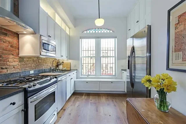 a living room with furniture and a lamp