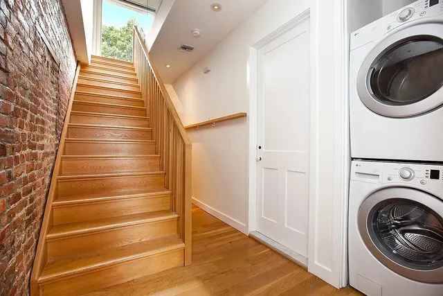 a view of a chair and table in the patio and garden