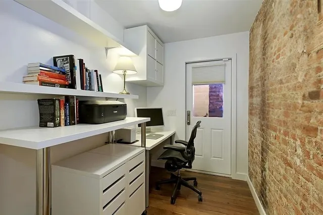 a bedroom with furniture and a book shelf