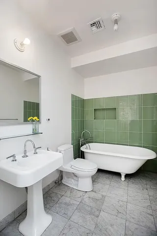 a bedroom with a bed and dresser