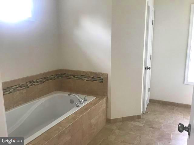 8363 WB&A Road Severn, MD 21144 - Photo 14 of 32 a white bath tub sitting in a bathroom