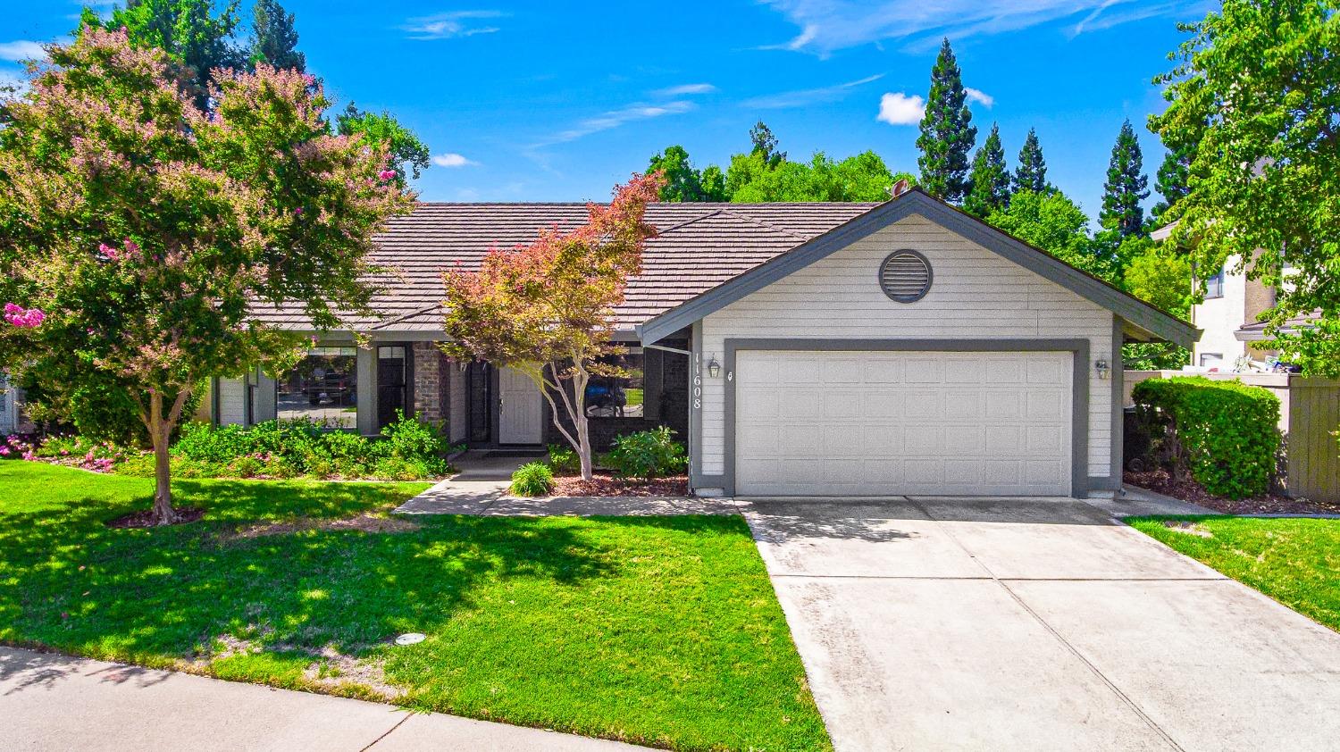 a front view of a house with a yard and porch