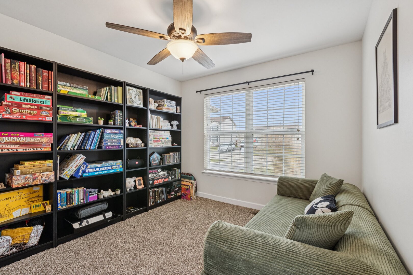 1024 Misty Landing Court Malta, IL 60150 - Photo 13 of 28 a living room with lots of furniture and a book shelf