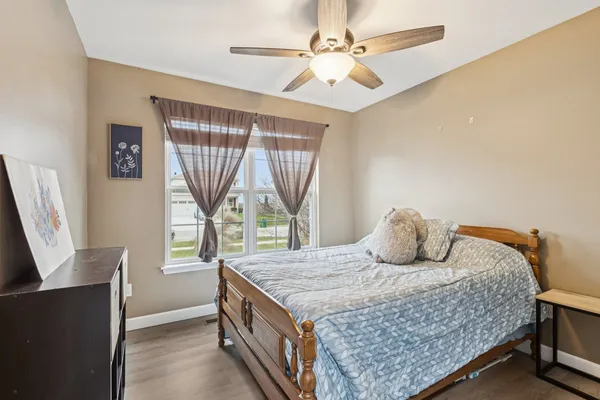 a bedroom with a bed and window