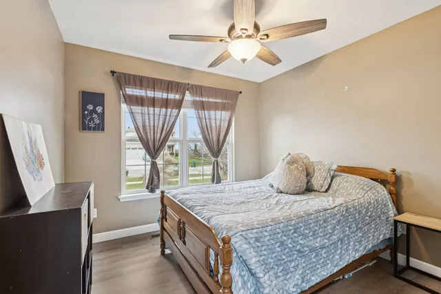 a bedroom with a bed and window