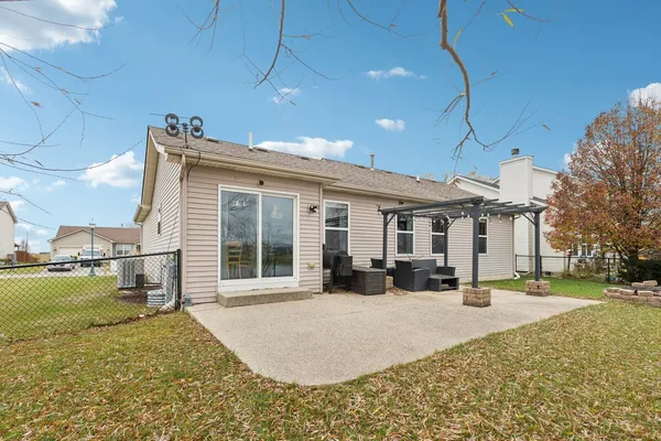 a view of a house with a yard covered in snow