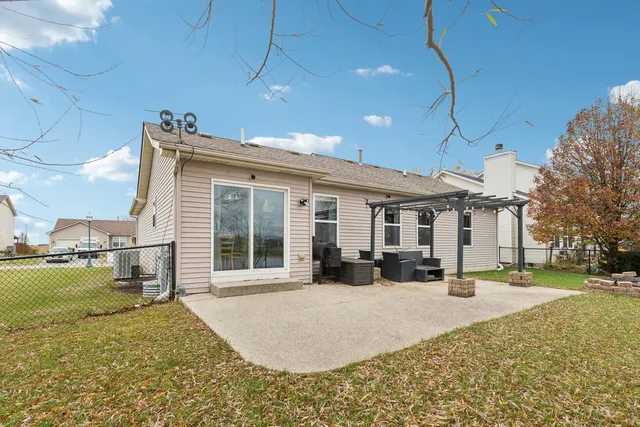 a view of a house with a yard covered in snow