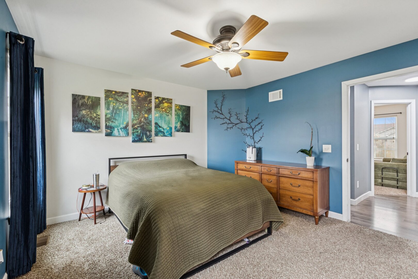 1024 Misty Landing Court Malta, IL 60150 - Photo 9 of 28 a bedroom with a bed and a chandelier