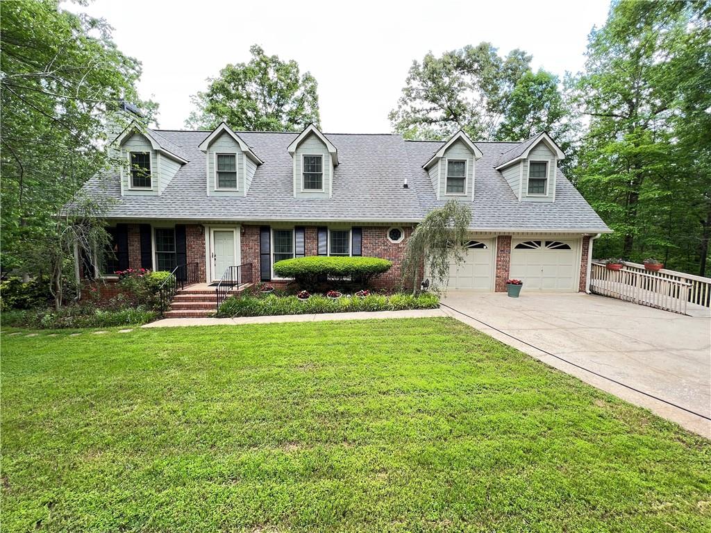 4035 East Chapel Hill Road Douglasville, GA 30135 - Photo 1 of 1 a front view of a house with garden