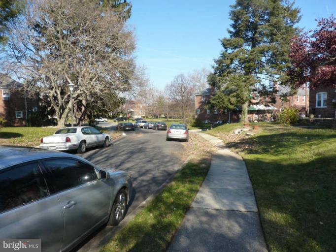 619 Stamford Road Baltimore, MD 21229 - Photo 2 of 17 a view of yard with swimming pool and green space