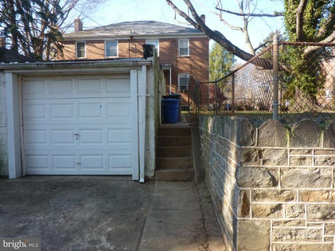 619 Stamford Road Baltimore, MD 21229 - Photo 16 of 17 front view of a house with a small yard