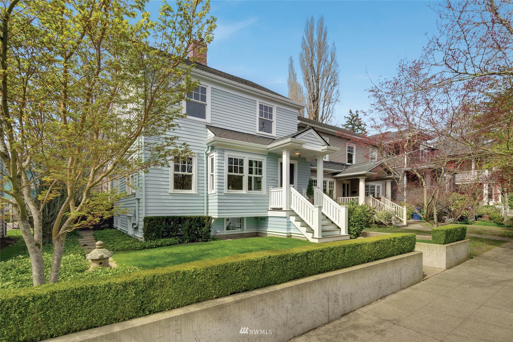 a front view of a house with a yard table and chairs