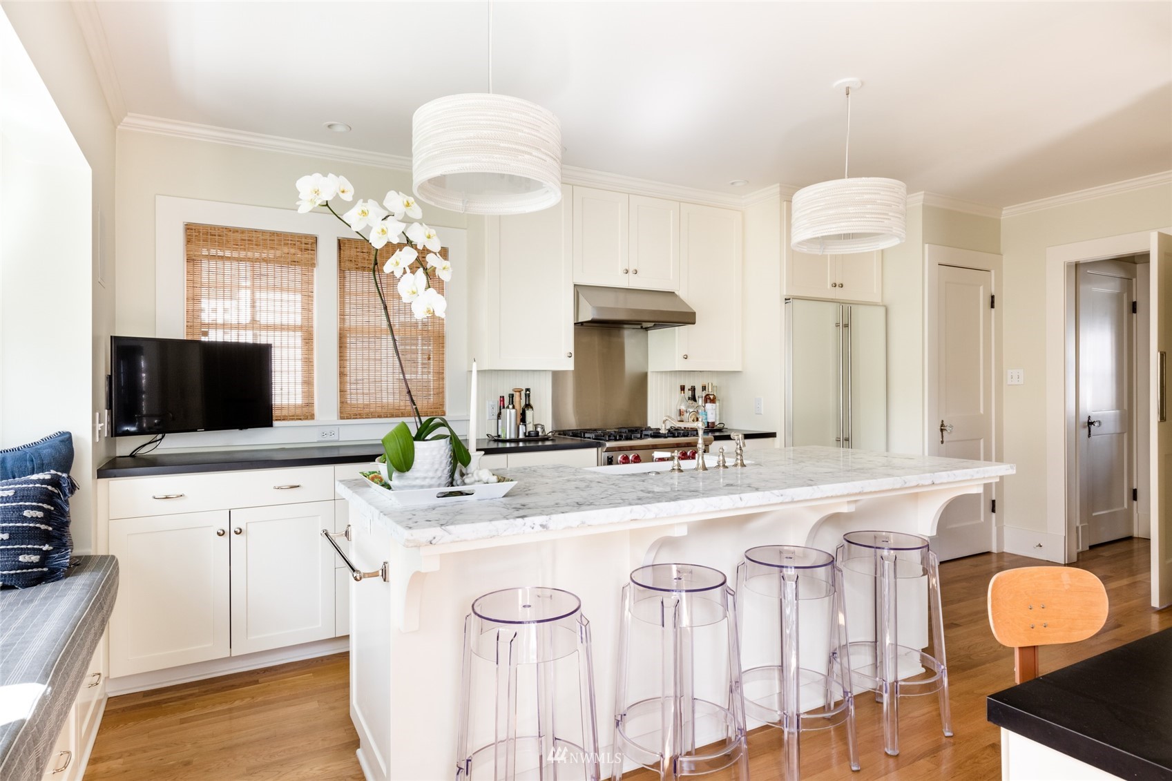 617 35th Avenue Seattle, WA 98122 - Photo 12 of 40 a kitchen with stainless steel appliances a sink a counter top space cabinets and a window