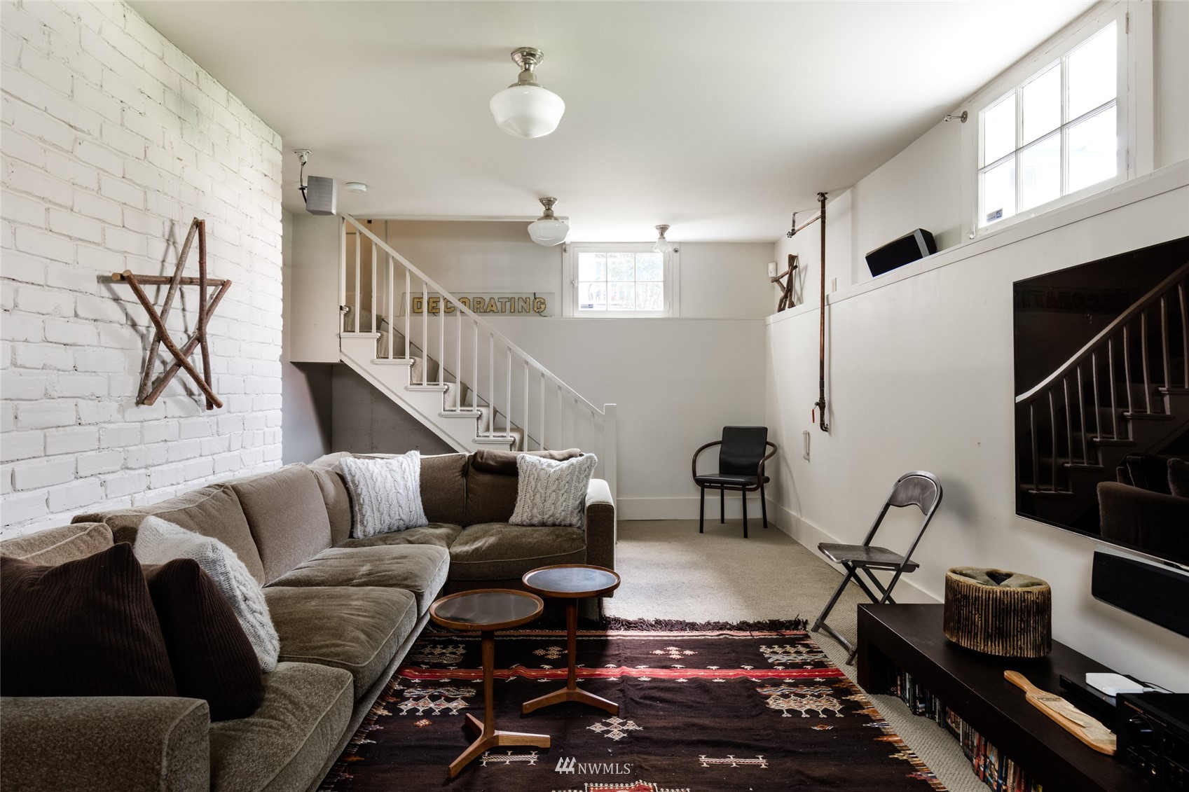 617 35th Avenue Seattle, WA 98122 - Photo 17 of 40 a living room with furniture or couch and a flat screen tv