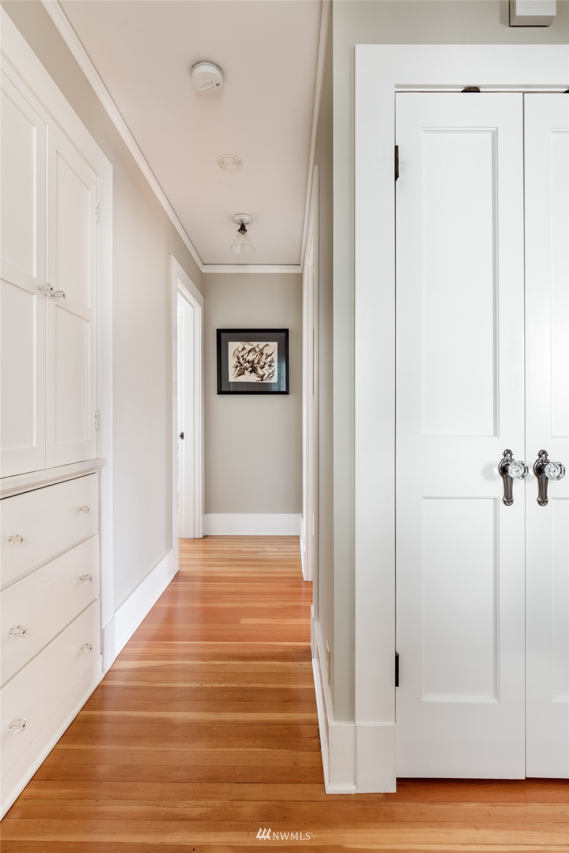 617 35th Avenue Seattle, WA 98122 - Photo 19 of 40 a view of a hallway with wooden floor and closet