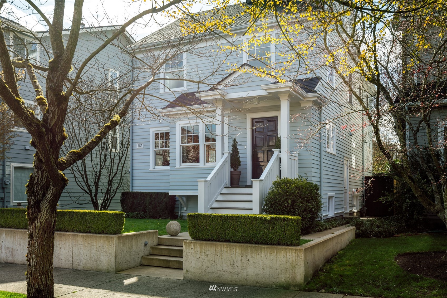 617 35th Avenue Seattle, WA 98122 - Photo 2 of 40 a front view of a house with a garden