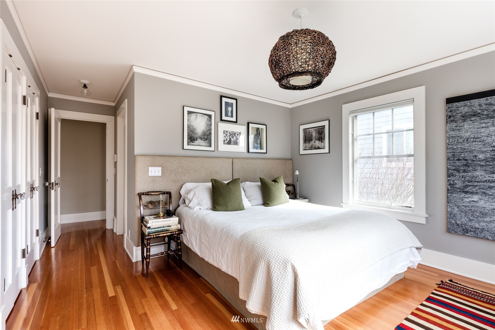 617 35th Avenue Seattle, WA 98122 - Photo 21 of 40 a bedroom with a bed and a large window