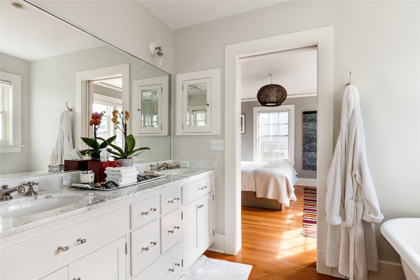 617 35th Avenue Seattle, WA 98122 - Photo 24 of 40 a bathroom with double vanity sink and a mirror