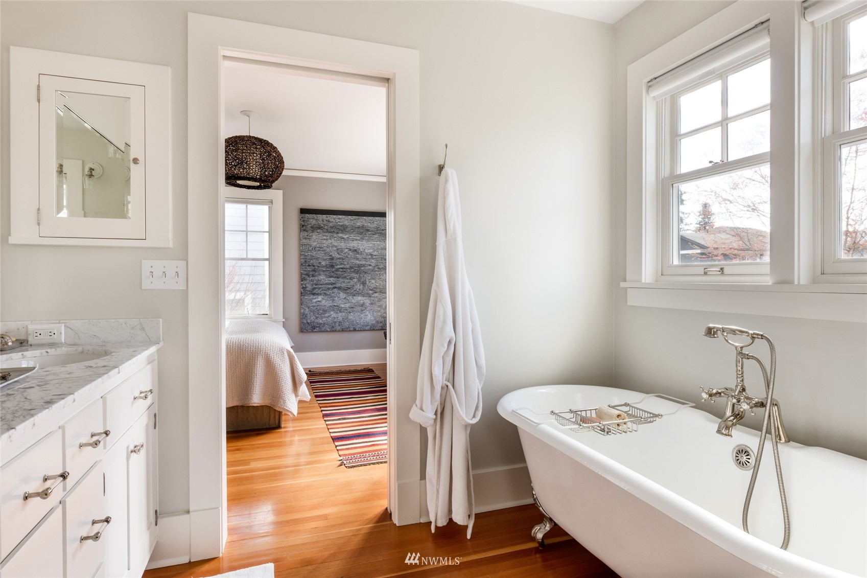 617 35th Avenue Seattle, WA 98122 - Photo 25 of 40 a bathroom with a tub a sink and a window