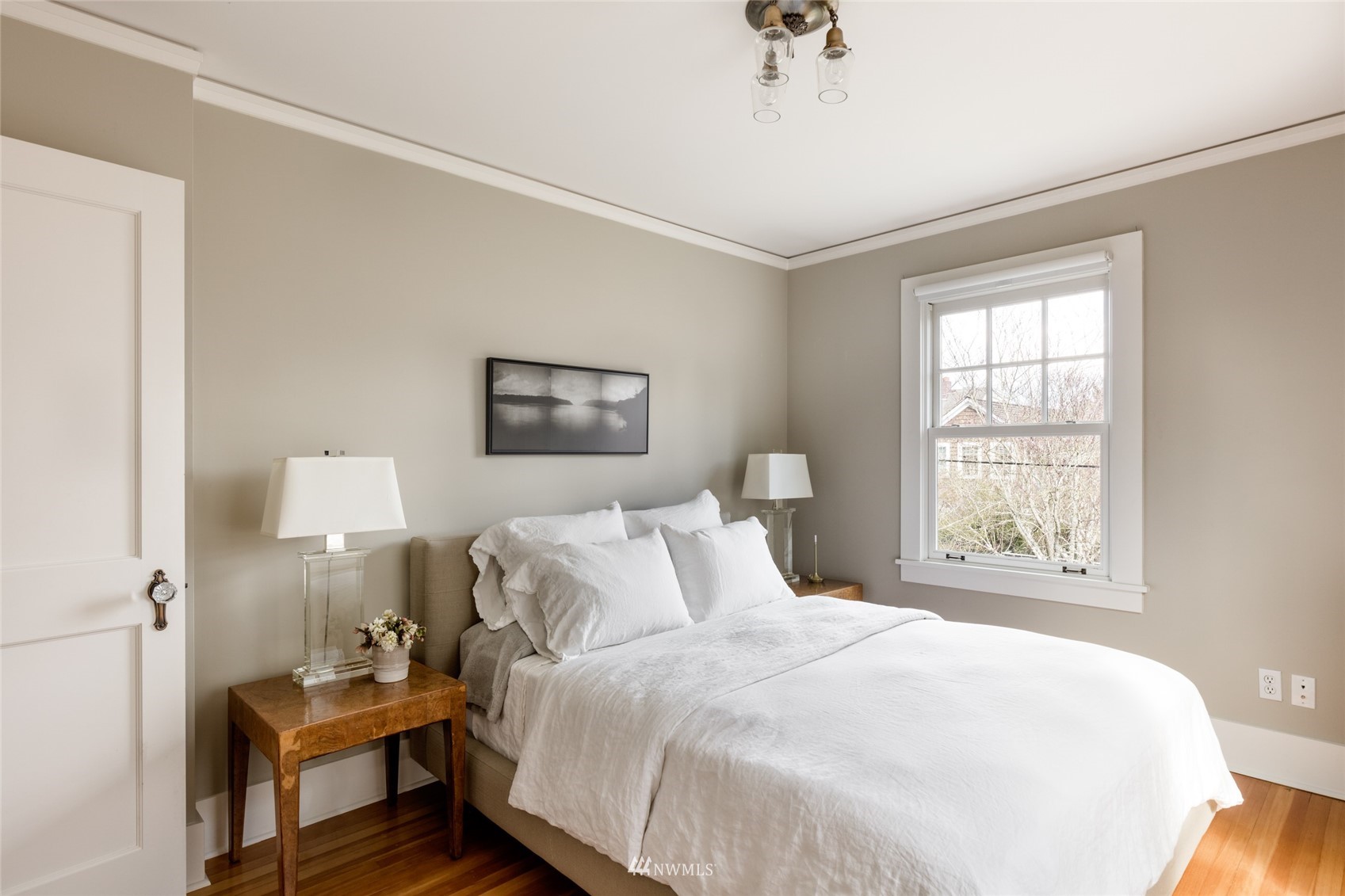 617 35th Avenue Seattle, WA 98122 - Photo 26 of 40 a bedroom with a bed and wooden floor