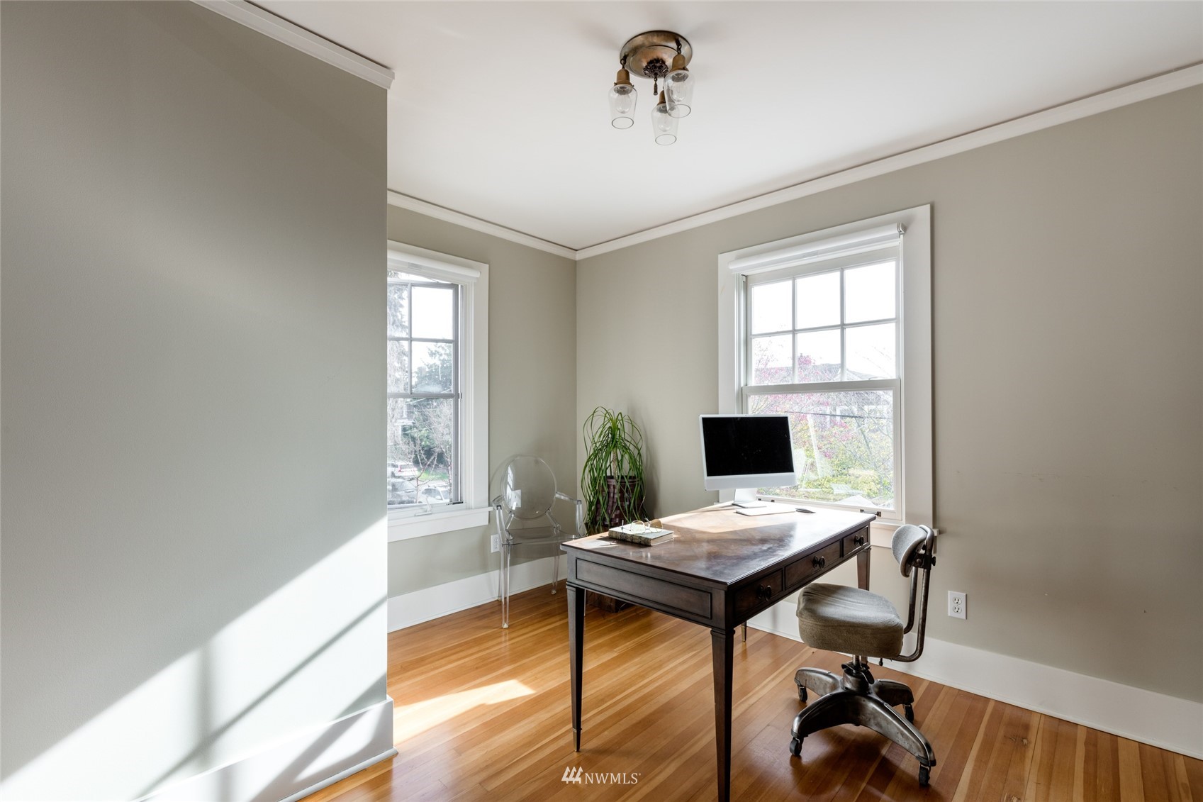 617 35th Avenue Seattle, WA 98122 - Photo 29 of 40 a view of a workspace with furniture and a window