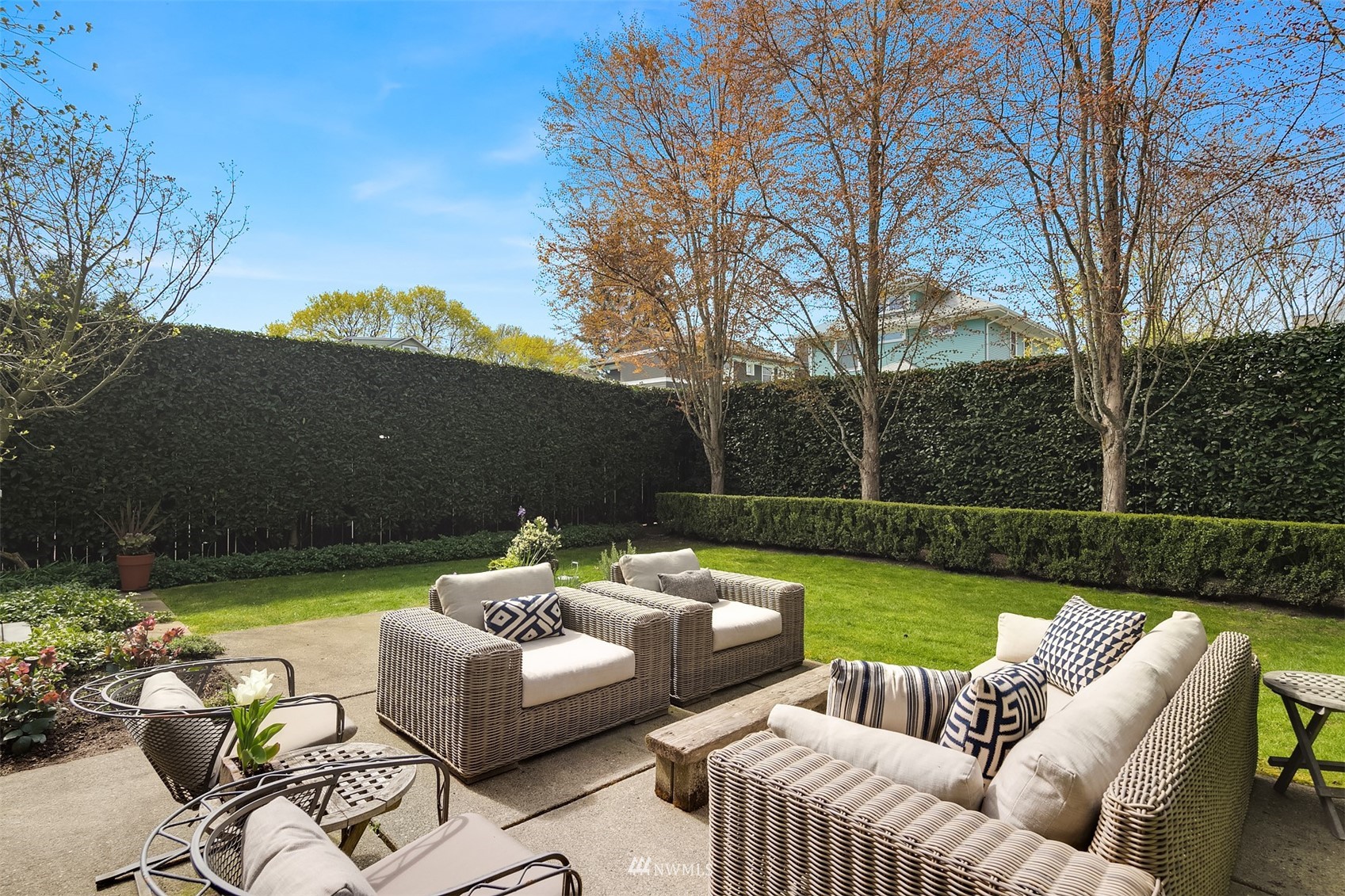 617 35th Avenue Seattle, WA 98122 - Photo 34 of 40 a view of a patio with couches chairs and a table and chairs with the view of lake