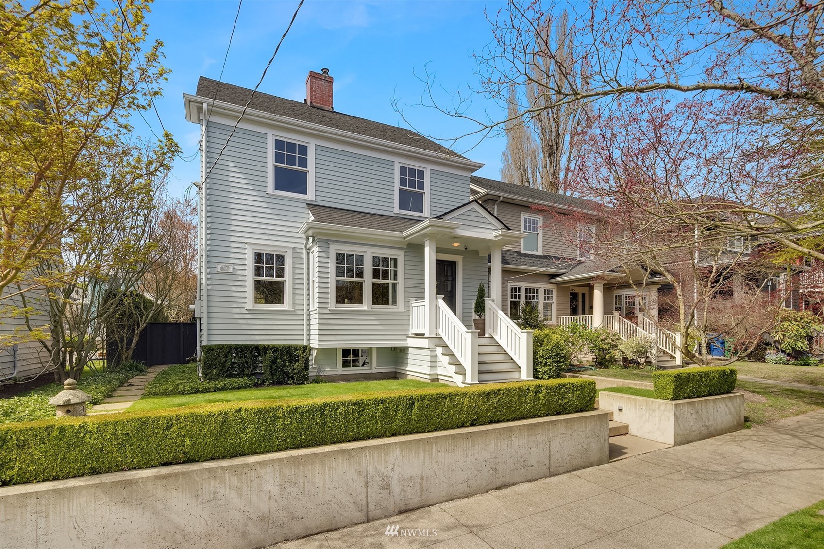 617 35th Avenue Seattle, WA 98122 - Photo 39 of 40 a front view of a house with a yard