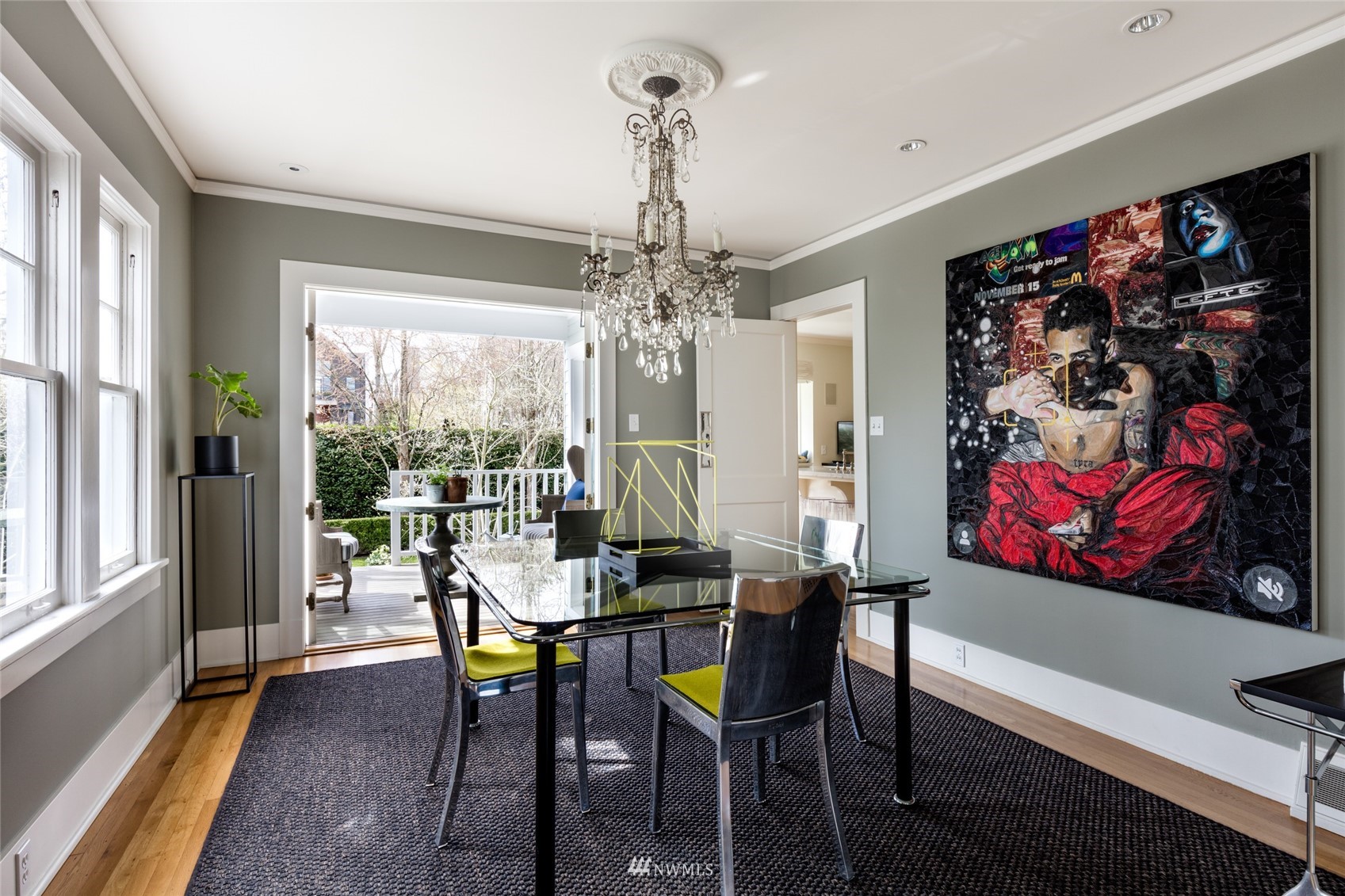 617 35th Avenue Seattle, WA 98122 - Photo 8 of 40 a view of a dining room with furniture a chandelier and large windows