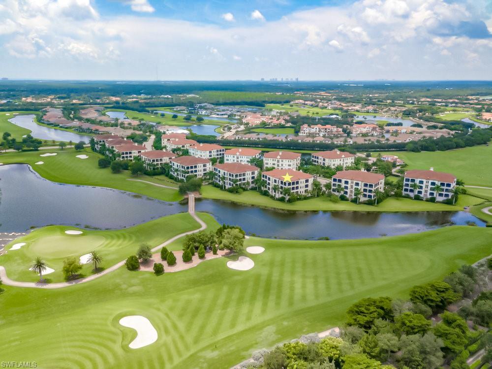 16444 Carrara Way, Unit 7301 Naples, FL 34110 - Photo 19 of 22 a view of a lake with a city