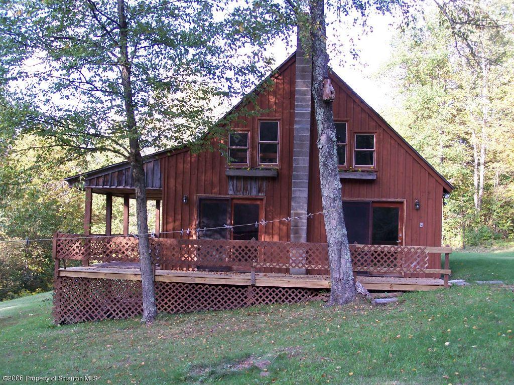 55 East Lemon Road Tunkhannock, PA 18657 - Photo 1 of 8 a front view of a house with a garden