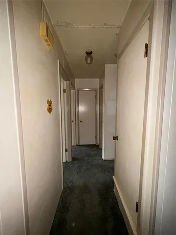 a view of a livingroom with a ceiling fan and window
