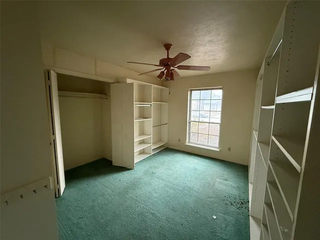 a bathroom with a granite countertop sink mirror bathtub and toilet