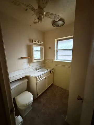 a bathroom with a shower and a sink