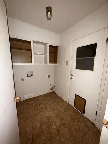 a view of empty room with window and fireplace