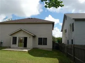 a view of a kitchen with a refrigerator a kitchen a sink and dishwasher