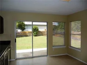 a view of an empty room and window