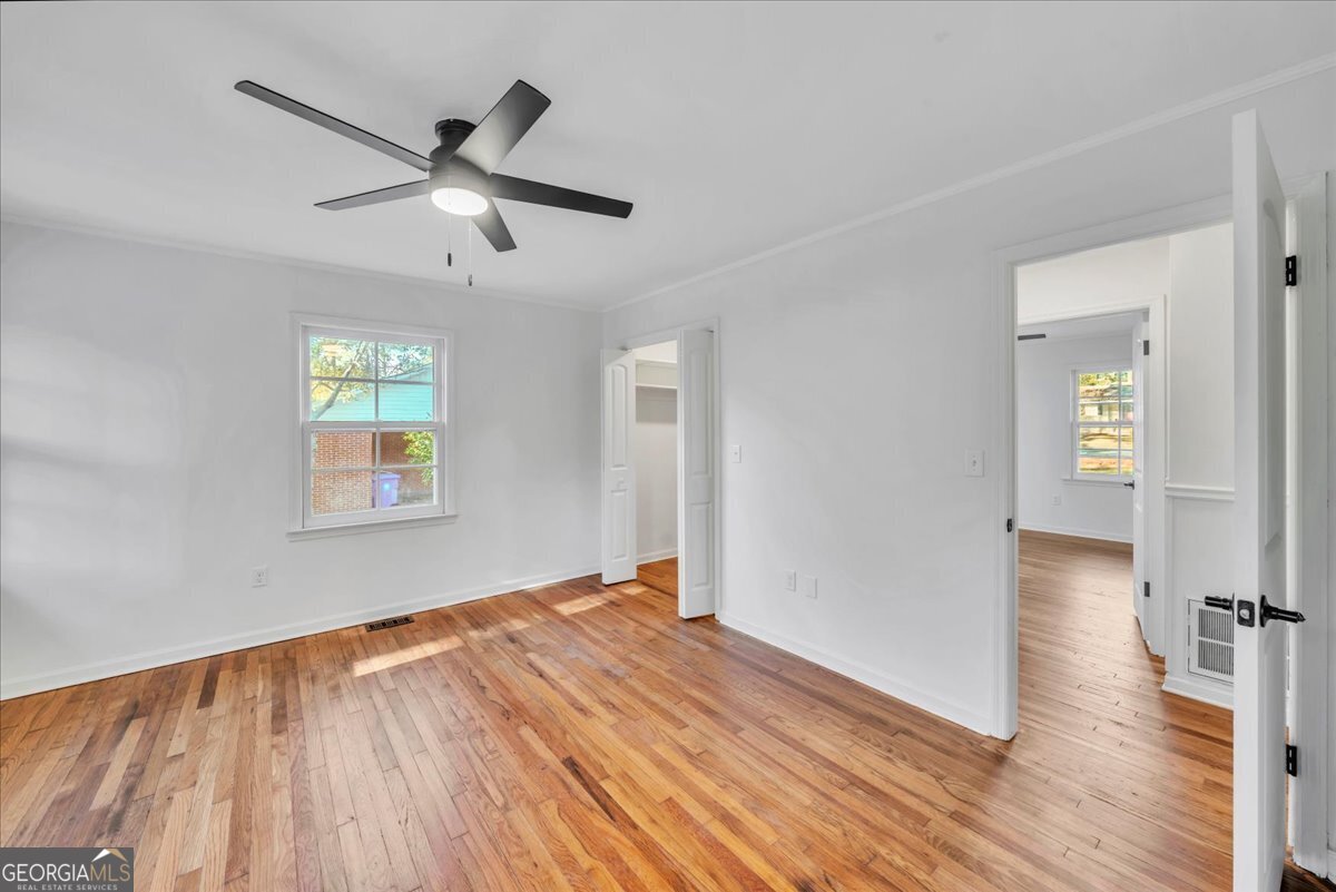 1806 Knox Street Dublin, GA 31021 - Photo 29 of 48 wooden floor in an empty room with a window