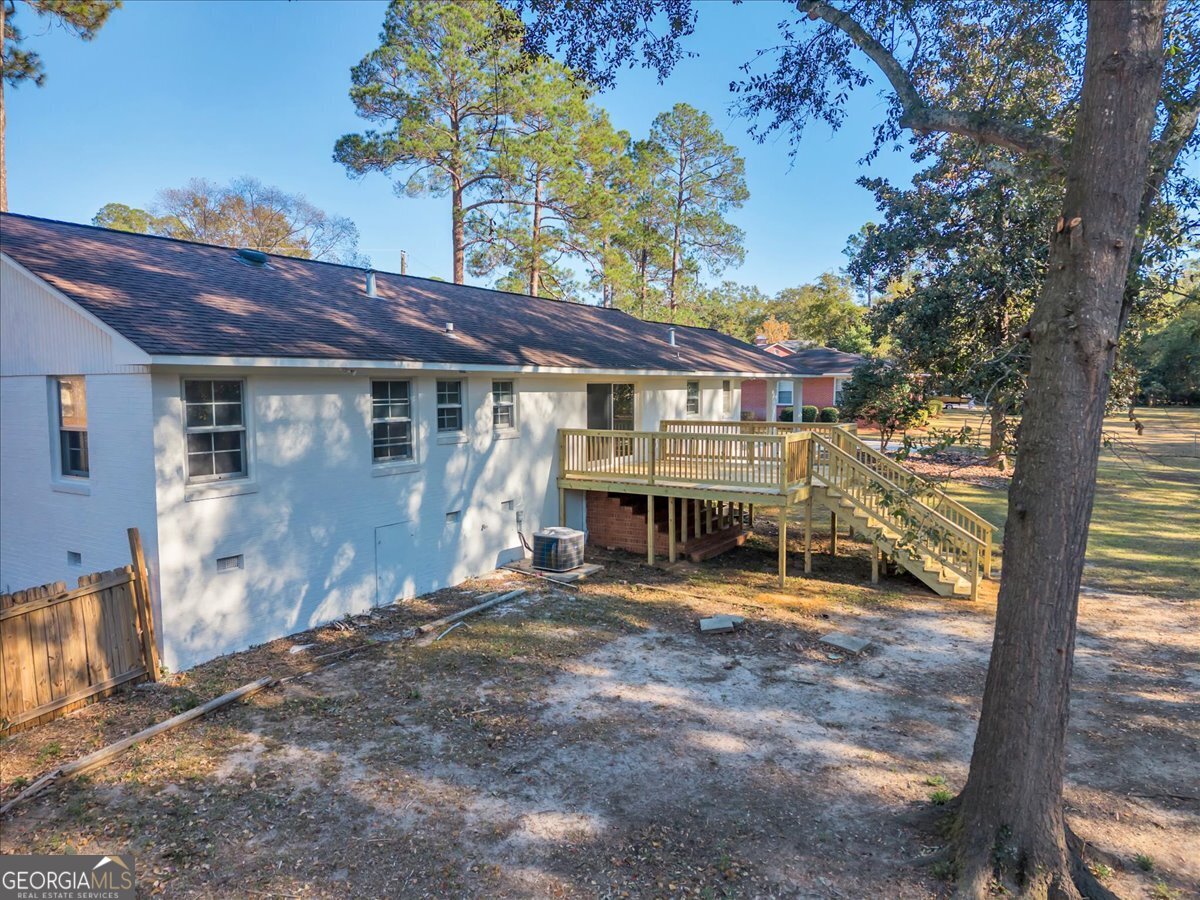 1806 Knox Street Dublin, GA 31021 - Photo 46 of 48 a view of a house with a large tree and wooden fence